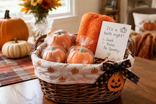 Halloween boo basket bath bombs for kids with pumpkin-shaped bath treats and an orange washcloth