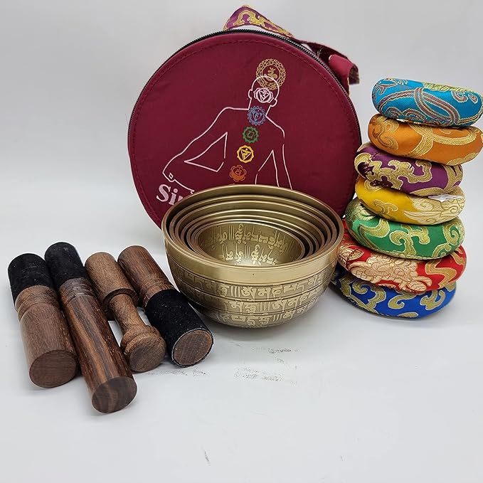 Khusi Tibetan singing bowls chakra sets, hand carved buddha mantra and symbol, sets of seven divine sound bowl. Khusi+Inc