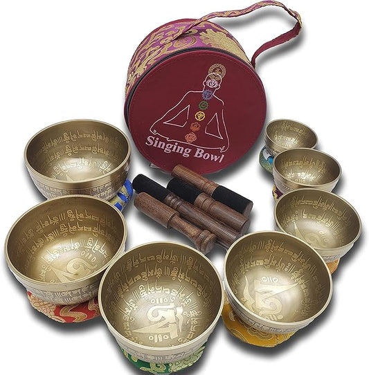 Khusi Tibetan singing bowls chakra sets, hand carved buddha mantra and symbol, sets of seven divine sound bowl. Khusi+Inc