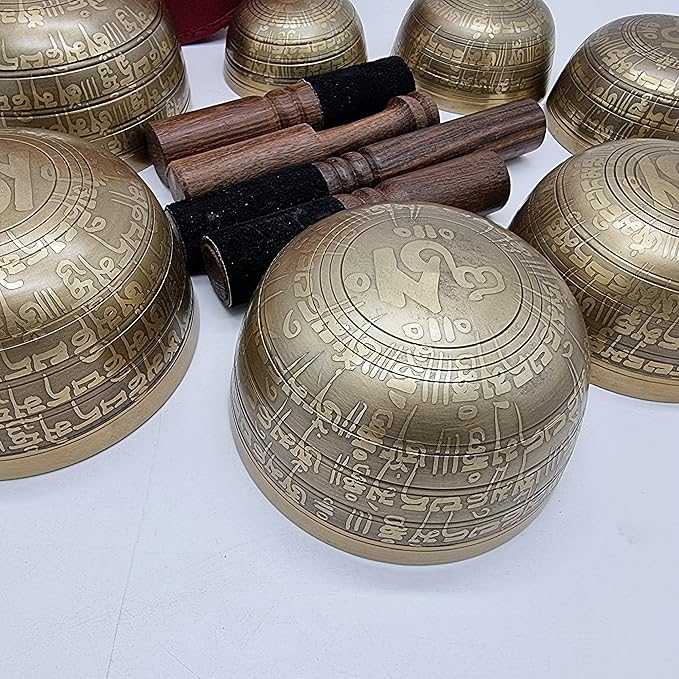 Khusi Tibetan singing bowls chakra sets, hand carved buddha mantra and symbol, sets of seven divine sound bowl. Khusi+Inc