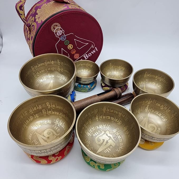 Khusi Tibetan singing bowls chakra sets, hand carved buddha mantra and symbol, sets of seven divine sound bowl. Khusi+Inc